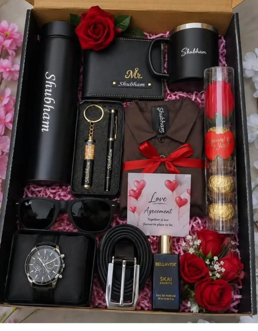 Personalized men's gift hamper with watch, wallet, perfume, and shirt in a box.