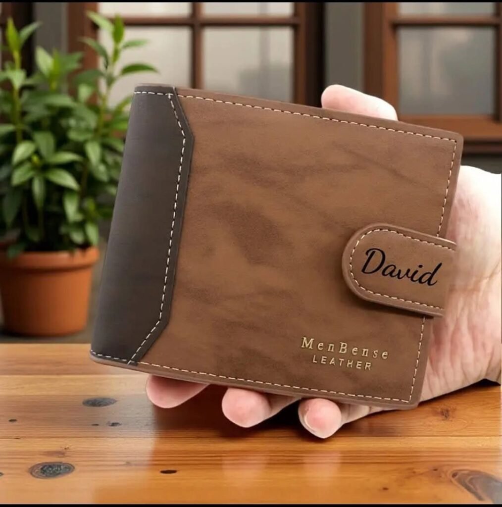 Brown leather wallet with the name David engraved on the closure strap.